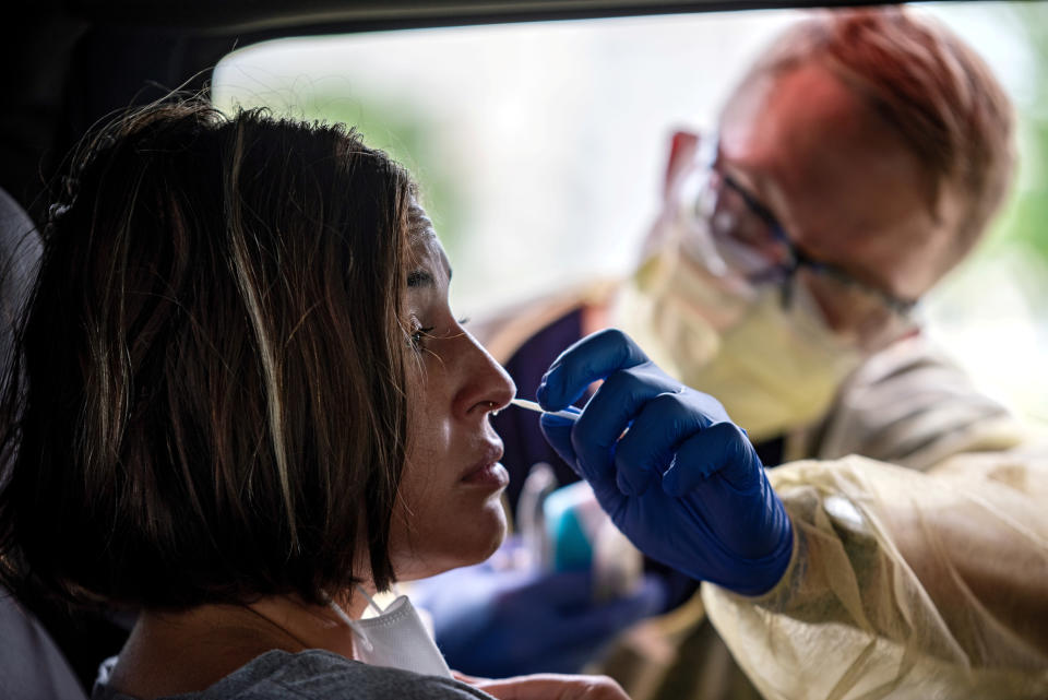 Atealla Betancourt is tested in a car for coronavirus disease (COVID-19) during an outbreak, in Austin, Texas, on June 28, 2020. REUTERS/Sergio Flores TPX IMAGES OF THE DAY