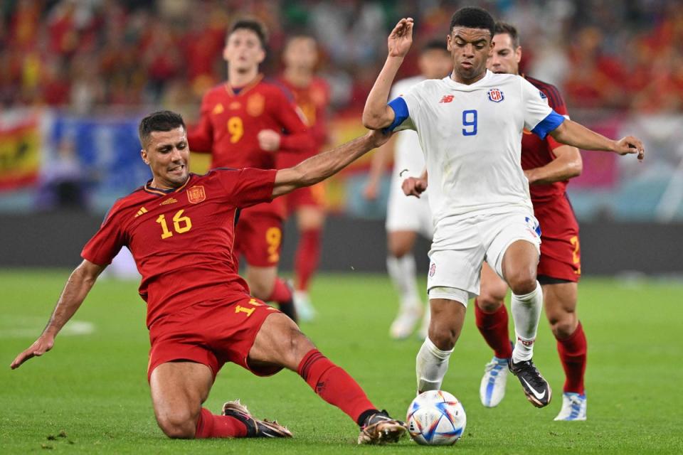 Manchester City midfielder Rodri (left) was stationed at centre back for Spain (AFP via Getty Images)