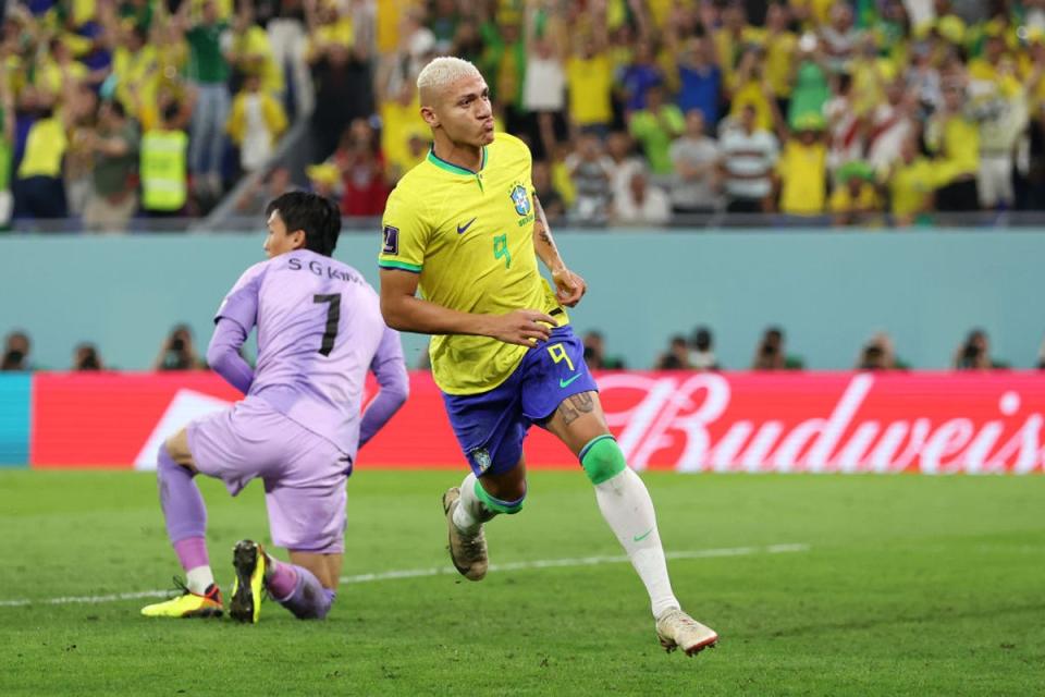 Richarlison wheels away to celebrate a stunning Brazil goal (Getty Images)
