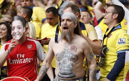 Arsenal fan shows off the FA Cup trophy painted on his chest. Action Images via Reuters / Carl Recine