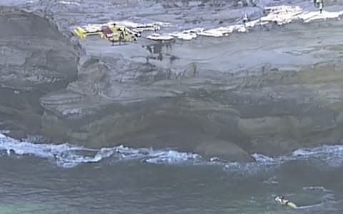 mergency vehicles at the scene where the body of a 18-year-old tourist was recovered in Cape Solander in Kurnell, Australia - Credit: 9 News