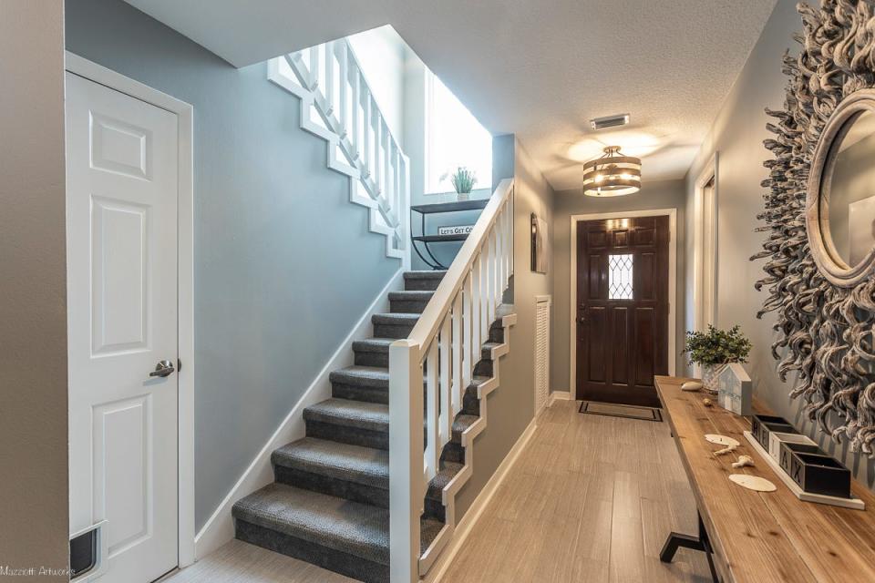 Subtle colors, new plank-tile flooring and update lighting invite you into this lovely townhome.