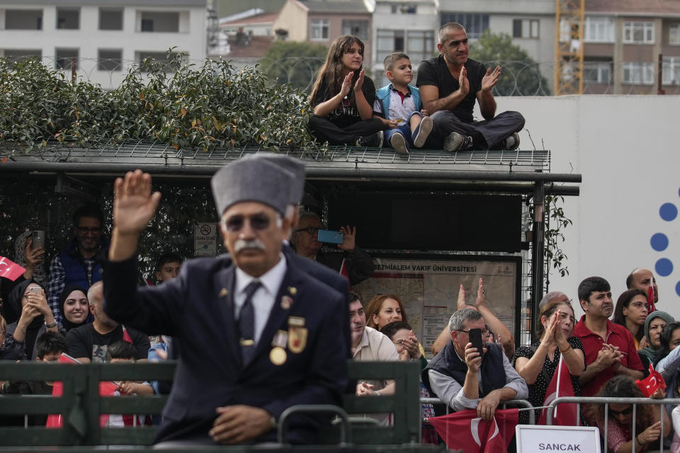 People watch the celebrations marking the 100th anniversary of the creation of the modern, secular Turkish Republic, in Istanbul, Turkey, Sunday, Oct. 29, 2023. (AP Photo/Emrah Gurel)