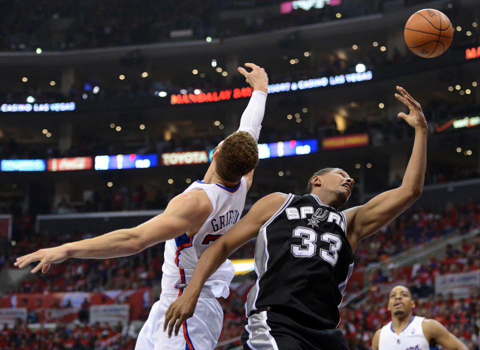 LOS ANGELES, CA - MAY 20: Boris Diaw #33 of the San Antonio Spurs goes up for a shot against Blake Griffin #32 of the Los Angeles Clippers in the first half in Game Four of the Western Conference Semifinals in the 2012 NBA Playoffs on May 20, 2011 at Staples Center in Los Angeles, California. NOTE TO USER: User expressly acknowledges and agrees that, by downloading and or using this photograph, User is consenting to the terms and conditions of the Getty Images License Agreement. (Photo by Harry How/Getty Images)