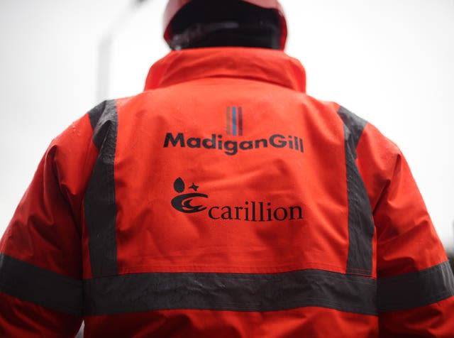 A worker wearing a hi-vis jacket at a Carillion construction site in central London