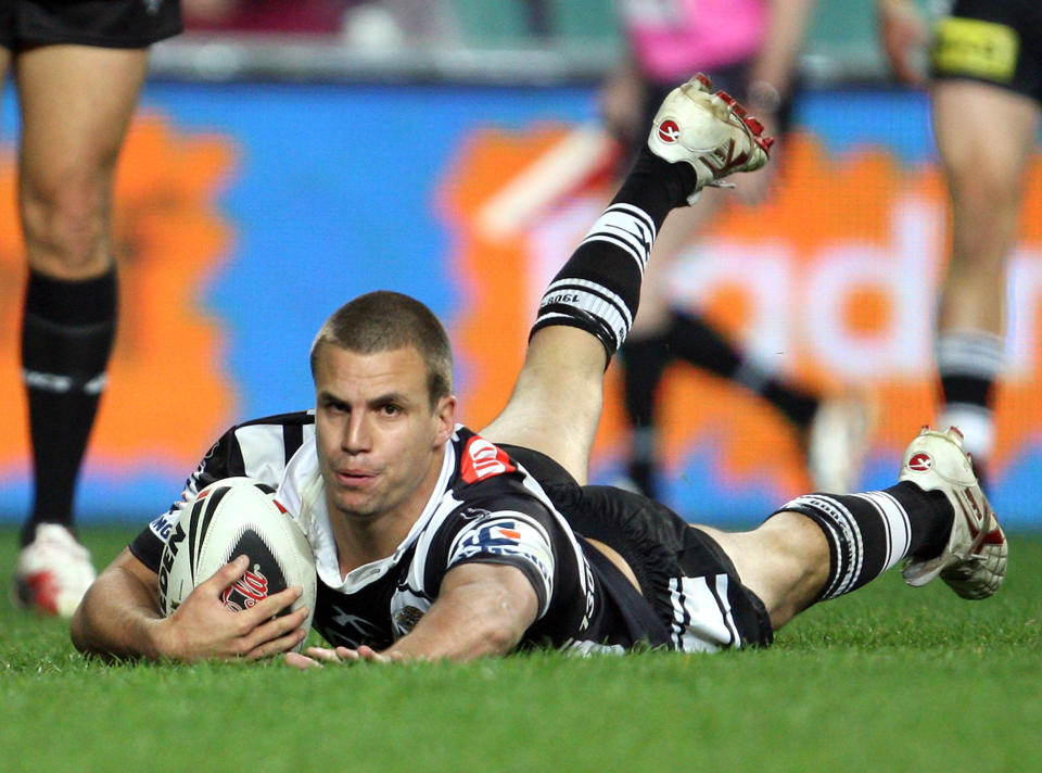Beau Ryan of the Tigers dives in to score a try during the round 21 NRL match between the Wests Tigers and the Manly Warringah Sea Eagles at the Sydney Football Stadium on August 3, 2009 in Sydney, Australia. 