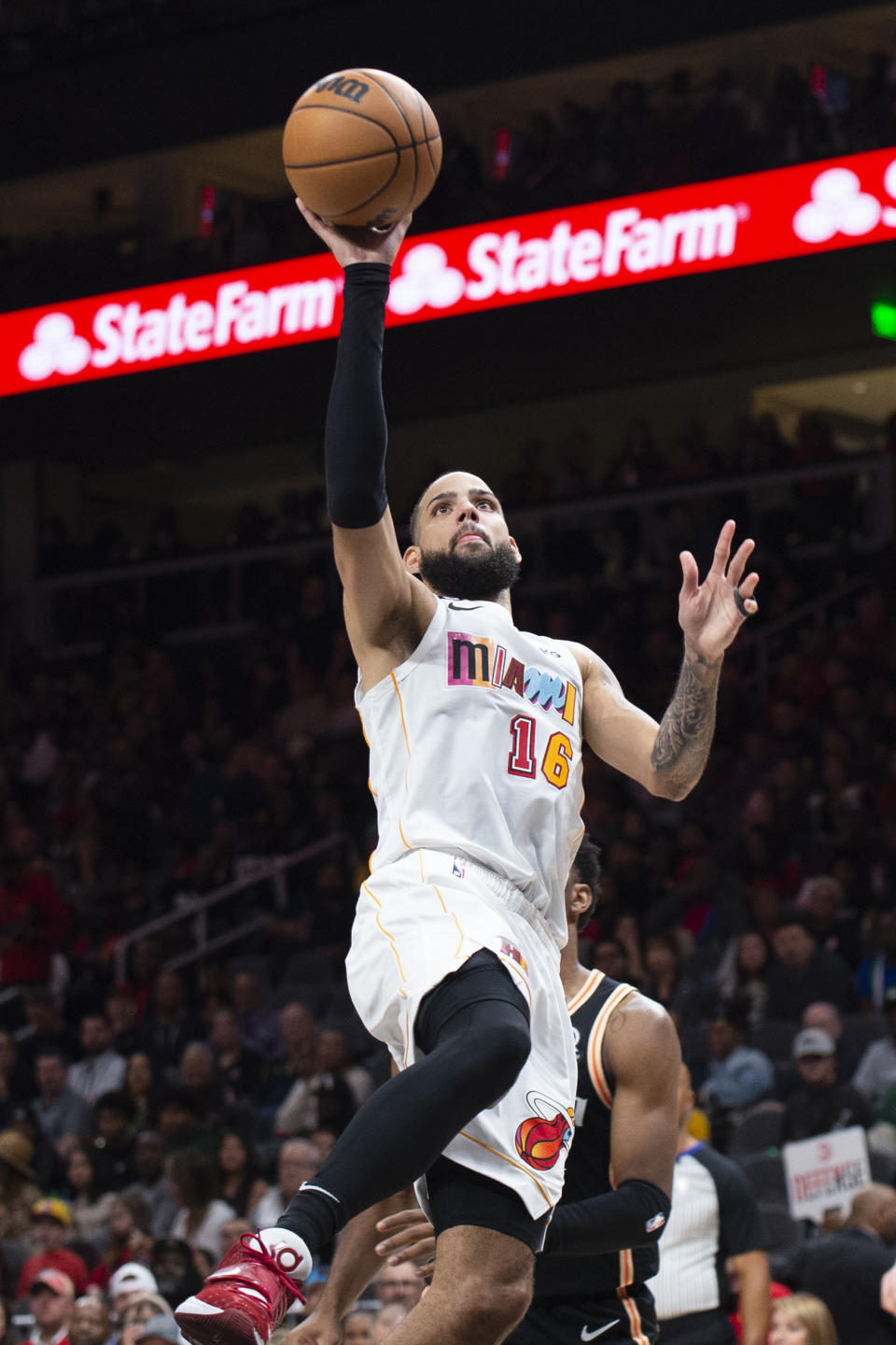 Miami Heat forward Caleb Martin shoots during the second half of an NBA basketball game against the Atlanta Hawks, Sunday, Nov. 27, 2022, in Atlanta. (AP Photo/Hakim Wright Sr.)