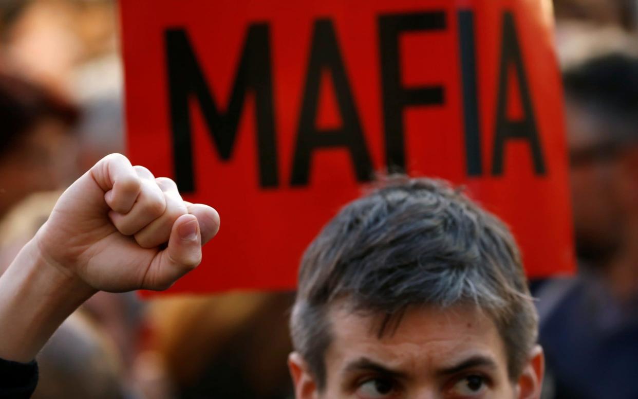 A protester outside the office of the prime minister in Valletta, Malta - REUTERS