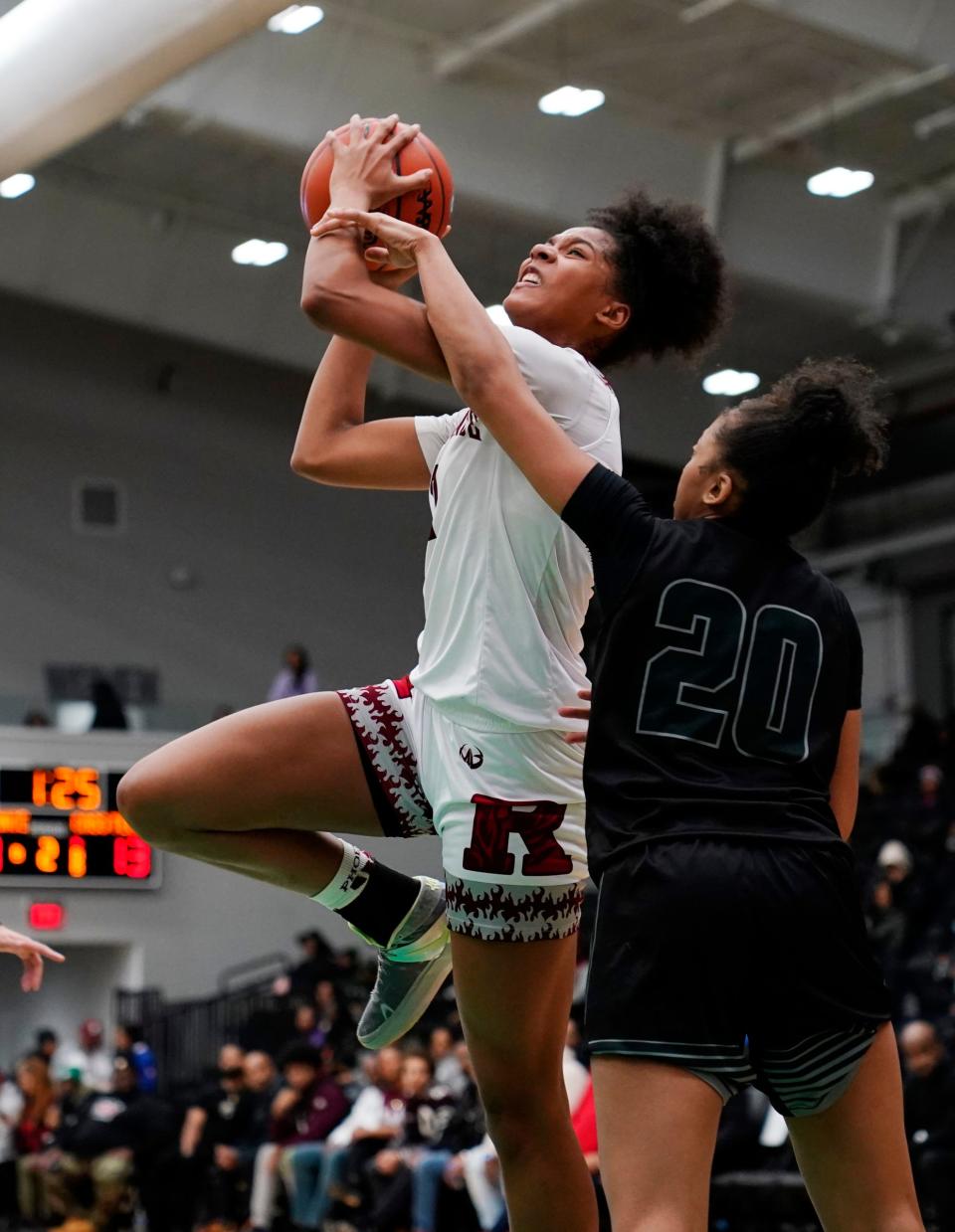 Detroit Renaissance's Anaya Hardy drives to the hoop as Detroit Cass Tech's Nyla Terrell (20) attempts a block in the first half of the Detroit PSL basketball final at Wayne State Fieldhouse in Detroit on Sunday, Feb. 18, 2024.