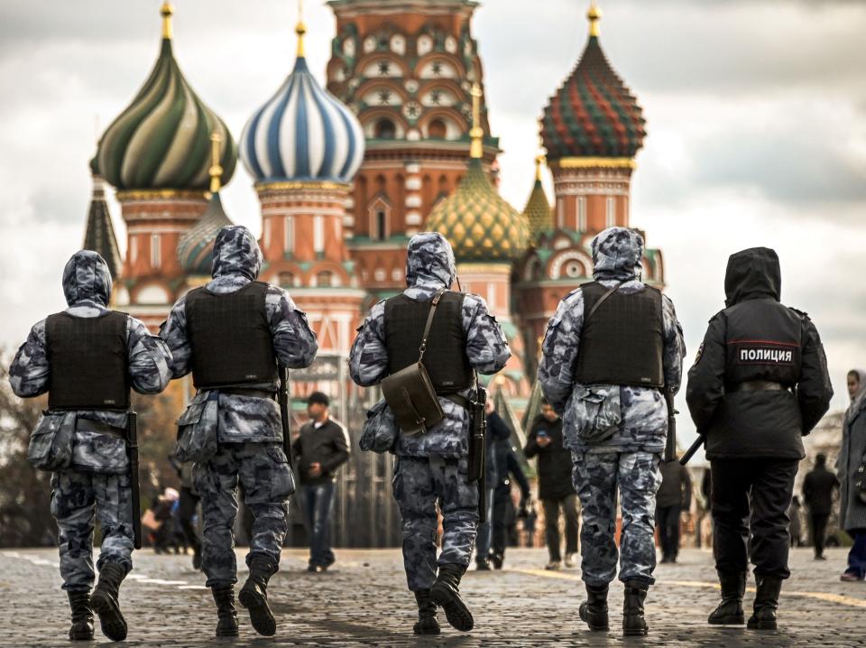 Russian police and National Guard (Rosgvardia) servicemen patrol Red Square in central Moscow.