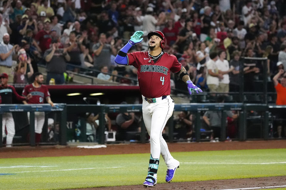 Arizona Diamondbacks' Ketel Marte rounds the bases after hitting a grand slam against the Toronto Blue Jays during the fifth inning of a baseball game, Sunday, July 14, 2024, in Phoenix. (AP Photo/Ross D. Franklin)