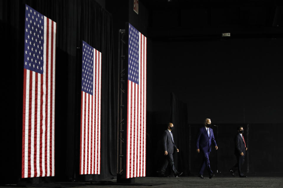 Democratic presidential candidate, former Vice President Joe Biden, second from right, arrives to speak at a campaign event, Tuesday, July 14, 2020, in Wilmington, Del. (AP Photo/Patrick Semansky)