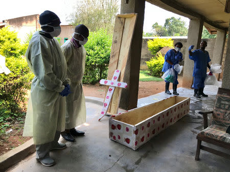 Health workers at Mangina hospital prepare to conduct a safe burial, in Beni, Democratic Republic of Congo, August 15, 2018. WHO/Nyka Alexander/Handout via REUTERS/File Photo