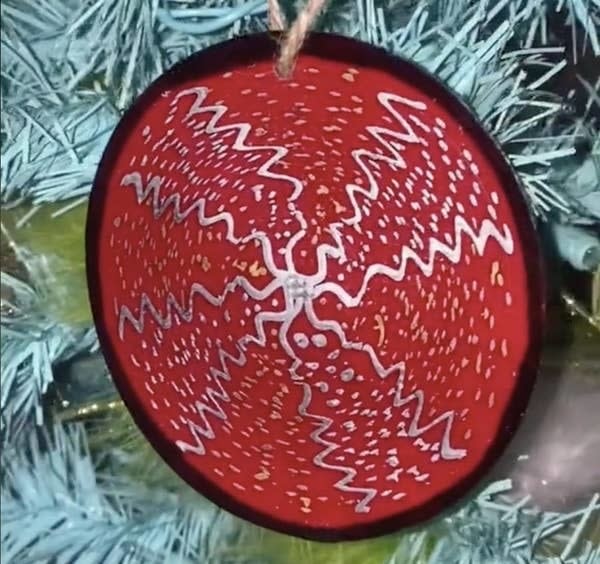 A melted cup with decorations