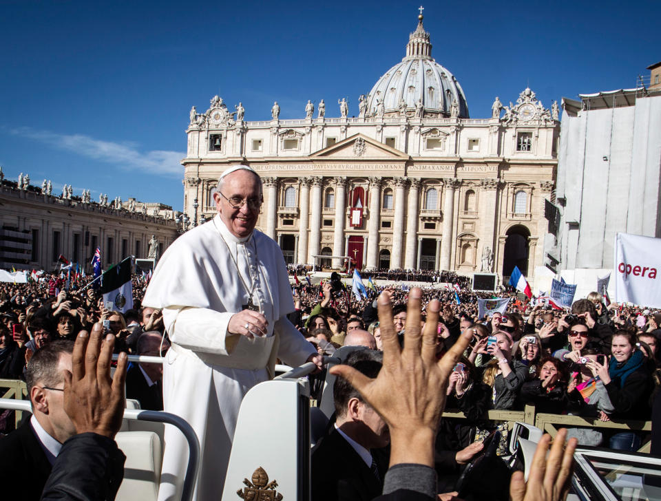 Pope Francis is driven through the crowd in his popemobile in St. Peter's Square for his inauguration Mass at the Vatican, Tuesday, March 19, 2013. Borgo, the sleepy, medieval neighborhood with a timeless feel right outside the Vatican's borders, has been at the service of pontiffs for centuries. From resoling to risotto, from light bulbs to linguine, Borgo is the go-to place for up-and-coming cardinals and sometimes even for popes.   (AP Photo/Angelo Carconi)