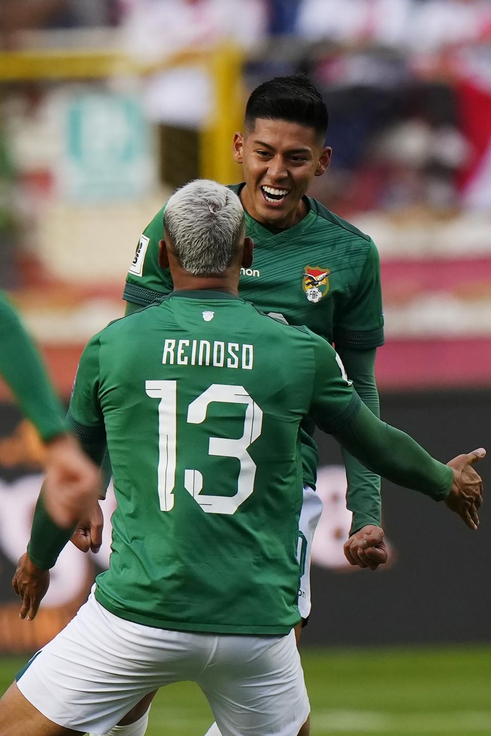 Bolivia's Ramiro Vaca, right, celebrates with teammate Jair Reinoso after scoring his side's second goal during a qualifying soccer match against Peru for the FIFA World Cup 2026, at Hernando Siles Stadium in La Paz, Bolivia, Thursday, Nov. 16, 2023. (AP Photo/Juan Karita)