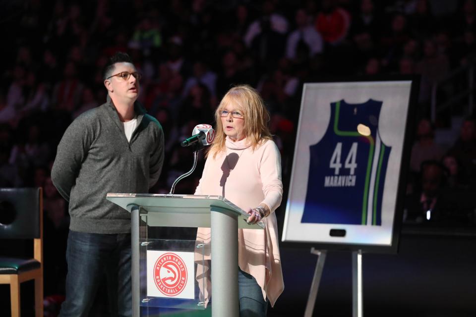 Josh Maravich and his mother Jackie speak on behalf of the late Pete Maravich during the Atlanta Hawks' retirement of Pete Maravich's jersey in 2017.