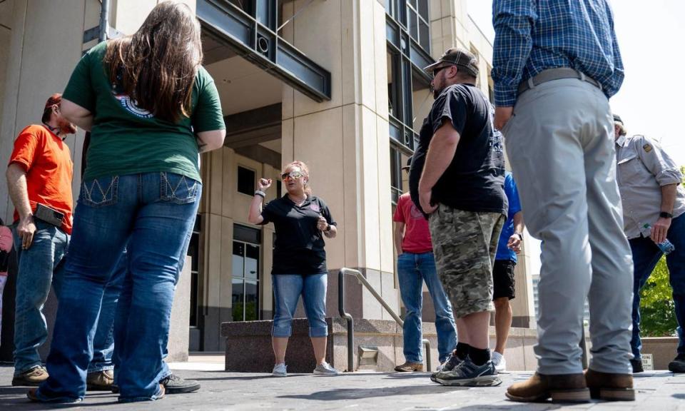 Jessie Manroe, center, a Boilermaker member from Grand Junction, Colo., spoke with other union members outside the federal courthouse in Kansas City, Kansas.