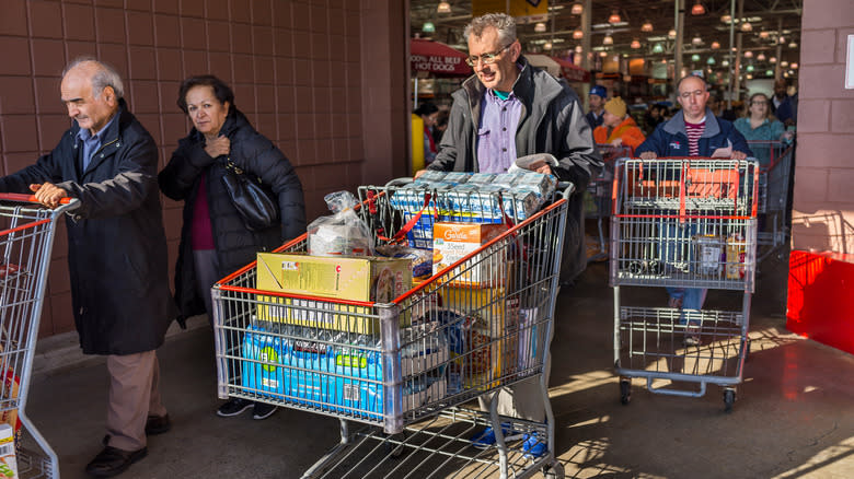 Costco shoppers with carts