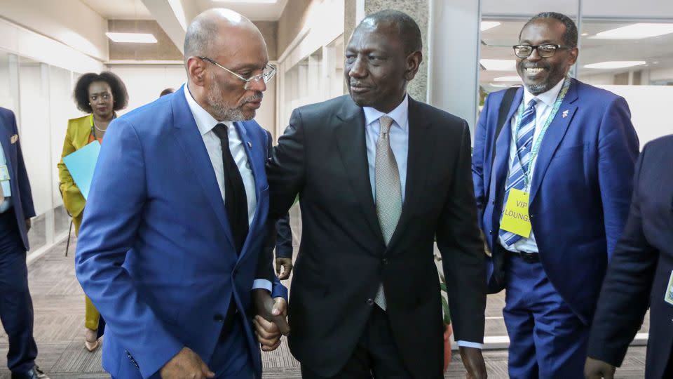 Former Prime Minister of Haiti Ariel Henry (left) with Kenyan President William Ruto (center) at the United Nations Environment Programme headquarters in Nairobi on February 29. - Daniel Irungu/EPA-EFE/Shutterstock