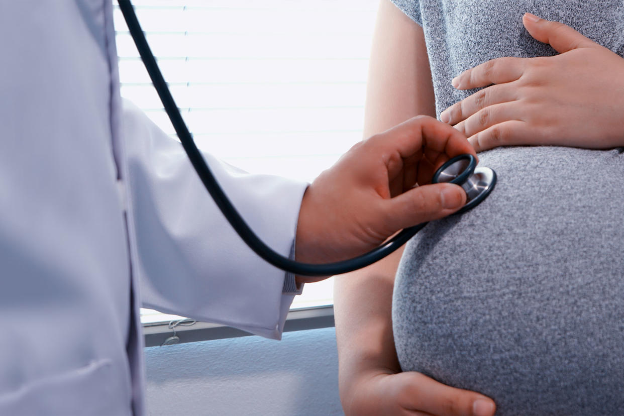 Doctor Examining Pregnant Woman Getty Images/chuanchai