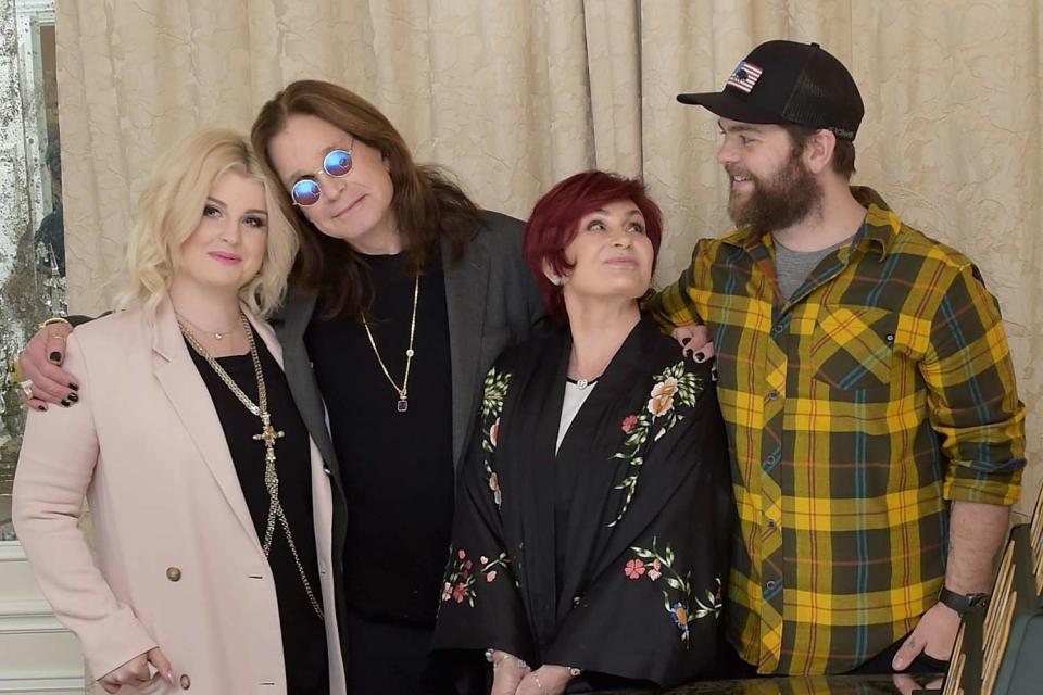 <p>Kevin Winter/Getty </p> Kelly Osbourne, Ozzy Osbourne, Sharon Osbourne and Jack Osbourne in Los Angeles in February 2018
