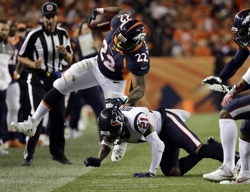 C.J. Anderson is tackled by Houston's AJ Bouye on Sunday - after Anderson suffered his torn meniscus. (AP)