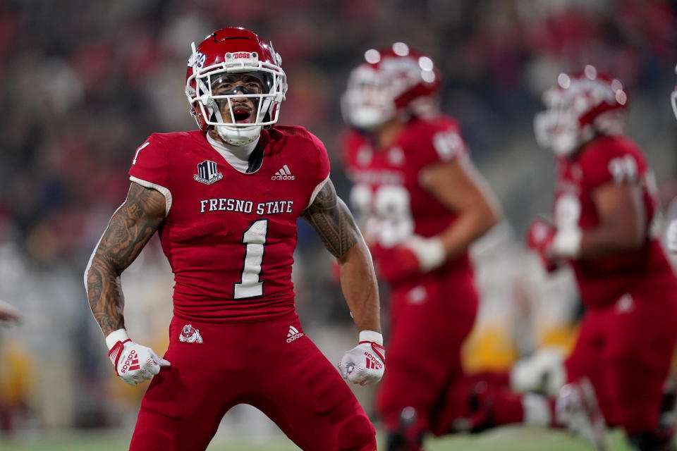 Nov 25, 2022; Fresno, California, USA; Fresno State Bulldogs wide receiver Nikko Remigio (1) reacts after catching a pass for a touchdown against the Wyoming Cowboys in the first quarter at Valley Children’s Stadium. Mandatory Credit: Cary Edmondson-USA TODAY Sports