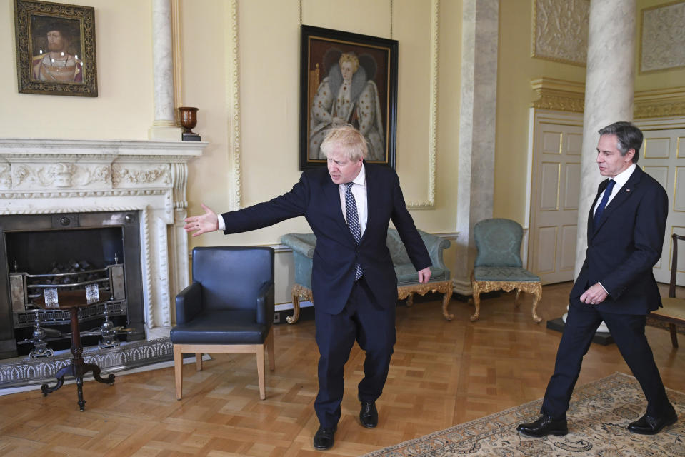 Britain's Prime Minister Boris Johnson, left, and US Secretary of State Antony Blinken inside 10 Downing Street in London, Tuesday, May 4, 2021. Foreign ministers from the Group of Seven wealthy industrialized nations gathered in London to grapple with threats to health, prosperity and democracy. It is their first face-to-face meeting in more than two years. (Stefan Rousseau/Pool via AP)