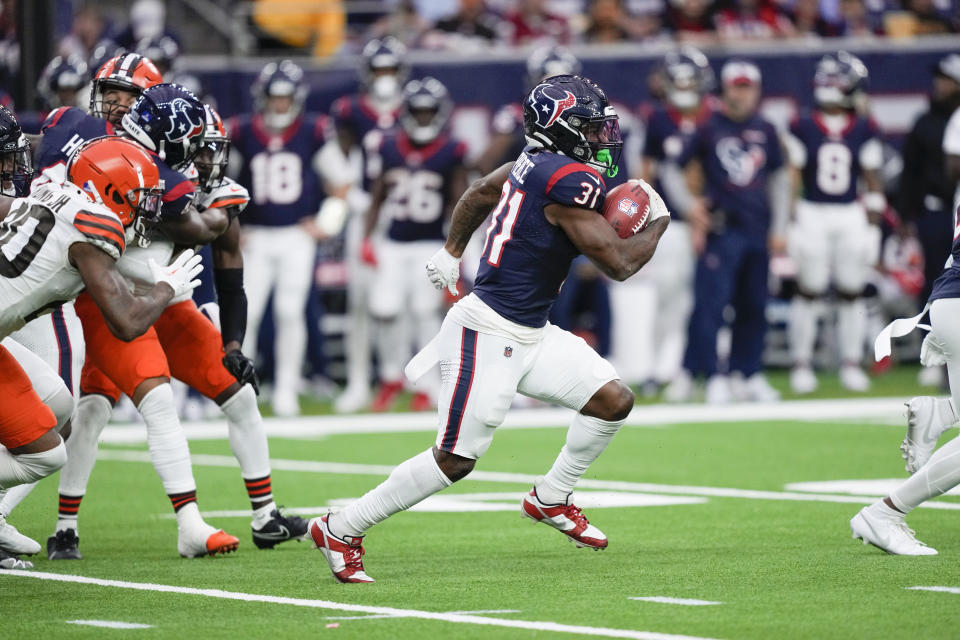 Houston Texans running back Dameon Pierce (31) returns a kickoff for a touchdown during the first half of an NFL football game against the Cleveland Browns, Sunday, Dec. 24, 2023, in Houston. (AP Photo/David J. Phillip)