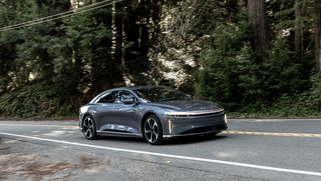 a dark gray 2024 lucid air on a road