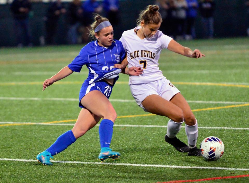 Greencastle's Rylee Henson (7) battles Hannah Sanson of Lower Dauphin. Greencastle battled Lower Dauphin for the District 3 Class 3A title on Thursday, November 3, 2022. Lower Dauphin won 2-0.