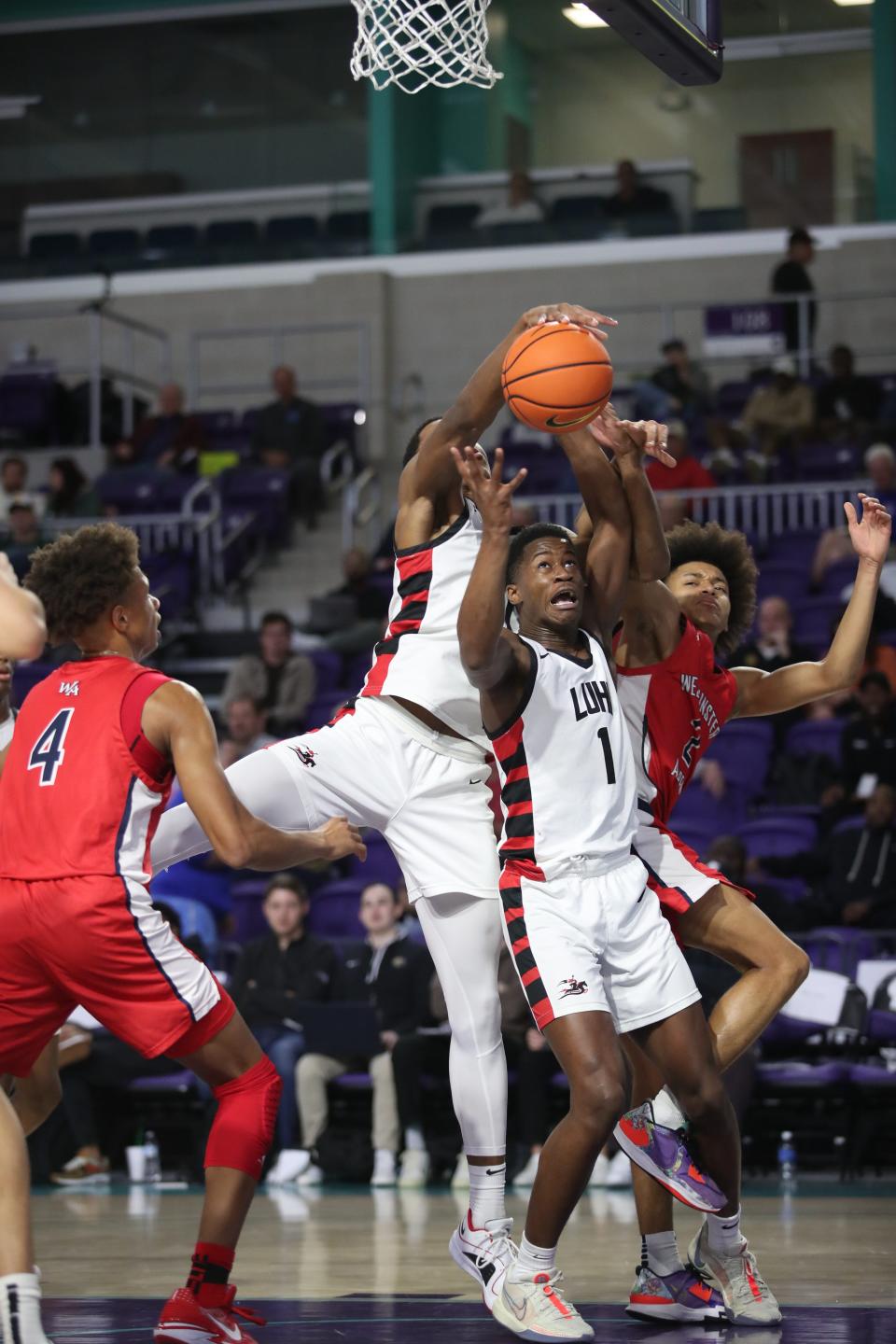 VJ Edgecombe of Long Island Lutheran and Ethan Bertrand of Westminster Academy go up for a rebound in the City of Palms Classic on Tuesday, Dec. 19, 2023, at Suncoast Credit Union Arena in Fort Myers.