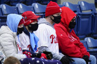 Philadelphia Phillies' fans bundle up to watch an opening day baseball game against the Atlanta Braves, Thursday, April 1, 2021, in Philadelphia. (AP Photo/Matt Slocum)