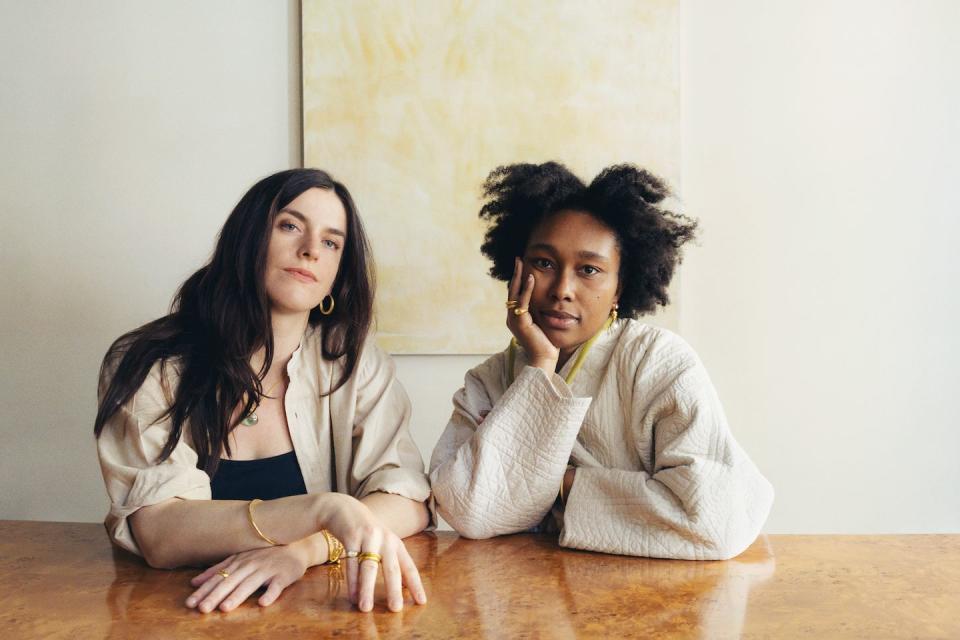 two women sitting at a table