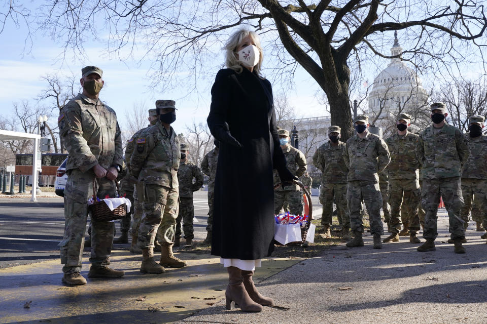 First lady Jill Biden surprises National Guard members outside the Capitol with chocolate chip cookies, Friday, Jan. 22, 2021, in Washington. (AP Photo/Jacquelyn Martin, Pool)