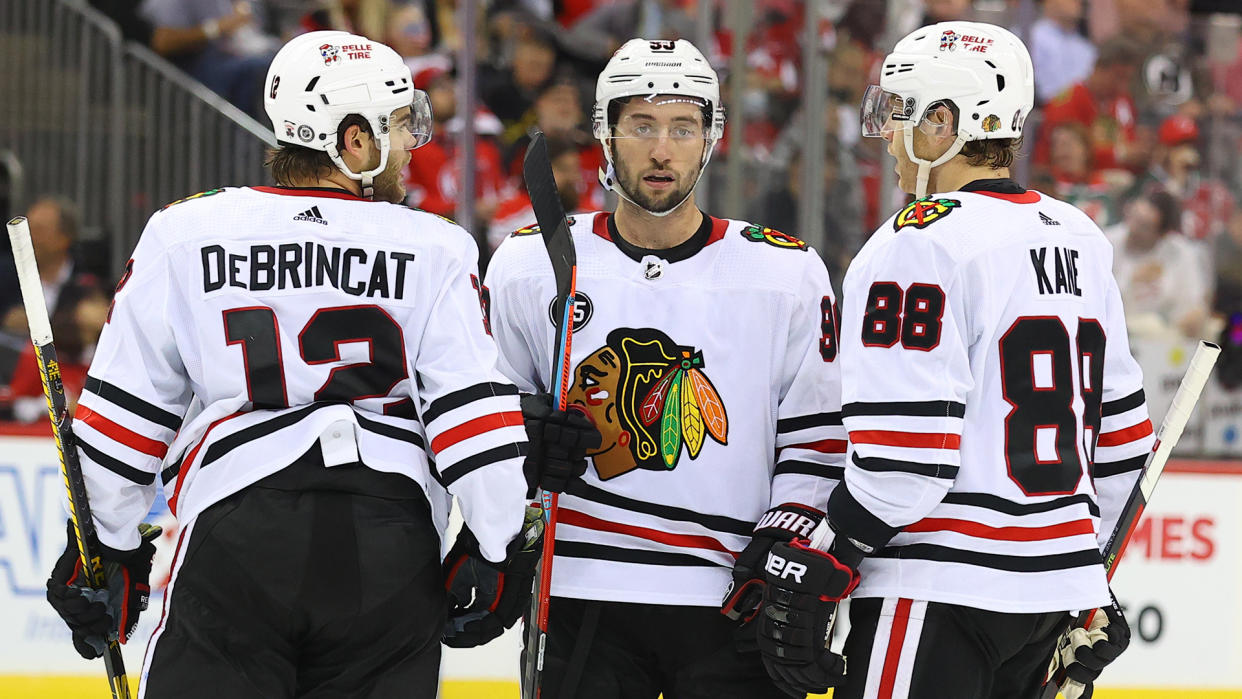 Tyler Johnson (middle) has plenty of exposure to Patrick Kane and Alex DeBrincat, making him valuable in fantasy hockey. (Photo by Rich Graessle/Icon Sportswire via Getty Images)