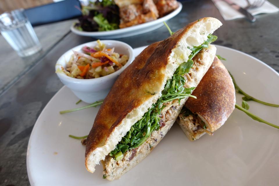 Albacore tuna salad sandwich with red onion, celery, raisins, Gaeta olives and arugula at Pane Bianco Van Buren in Phoenix.