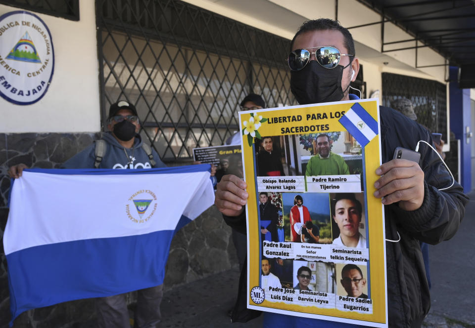 A Western Democratic Movement activist holds a poster with a message that reads in Spanish; “Free the priests,” and images of clergy imprisoned by the government of Daniel Ortega, including Bishop Rolando Álvarez of Matagalpa, during a protest outside the Nicaraguan embassy, in San Jose, Costa Rica, Monday, Feb. 20, 2023. Nicaragua Nunca Más, a human rights organization, andCSW, a British-based organization that advocates for religious freedom around the world, say Ortega’s government has targeted evangelical pastors, as well as Catholic personnel. (AP Photo/Carlos Gonzalez)