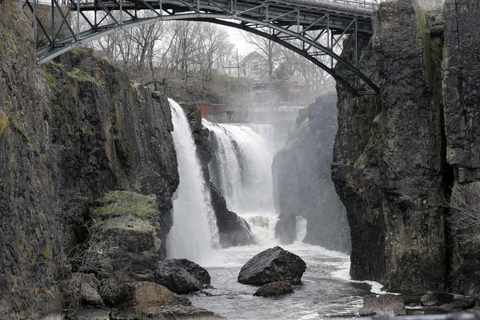 FILE - This April 13, 2013 file photo shows the Great Falls in Paterson, N.J. The waterfall and national park is one of a number of attractions in Northern New Jersey that may be of interest to Super Bowl visitors looking for things to see and do in the days before the big game. (AP Photo/Mel Evans, File)