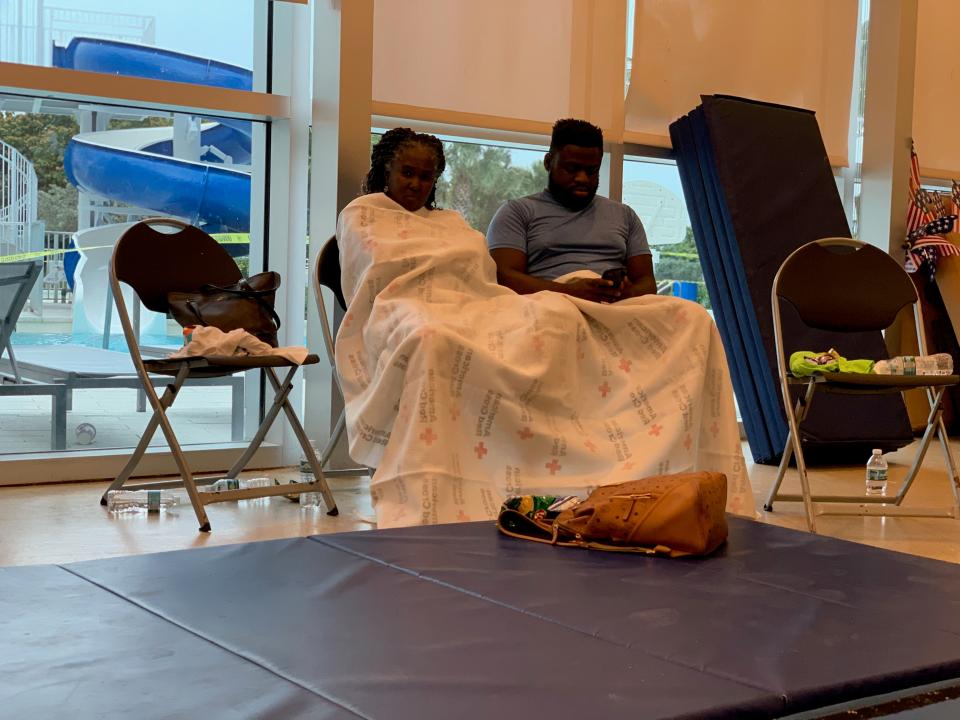 The American Red Cross set up a reunification site for family and friends near the site of the partial building collapse of a 12-story condominium early Thursday, June 24, 2021, in Surfside, Fla. About 70 people crammed into a room with chairs and blue gym mats on the floor.