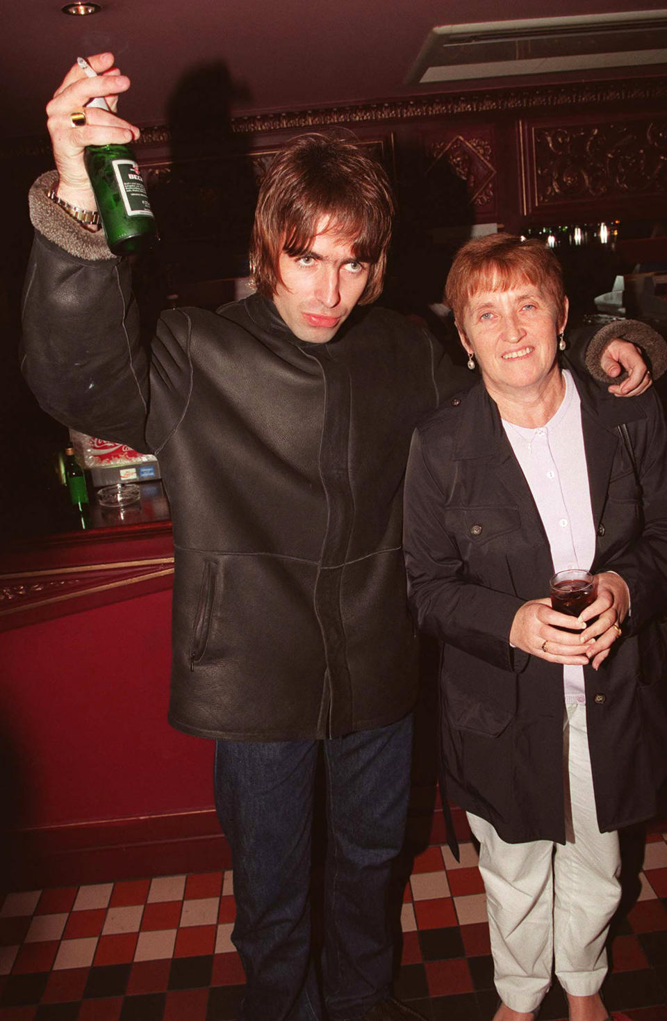 LONDON - 1995: Oasis lead singer Liam Gallagher with is mother Peggy Gallagher at the opening night of Steve Coogan's comedy show in the West End, London. (Photo by Dave Hogan/Getty Images)