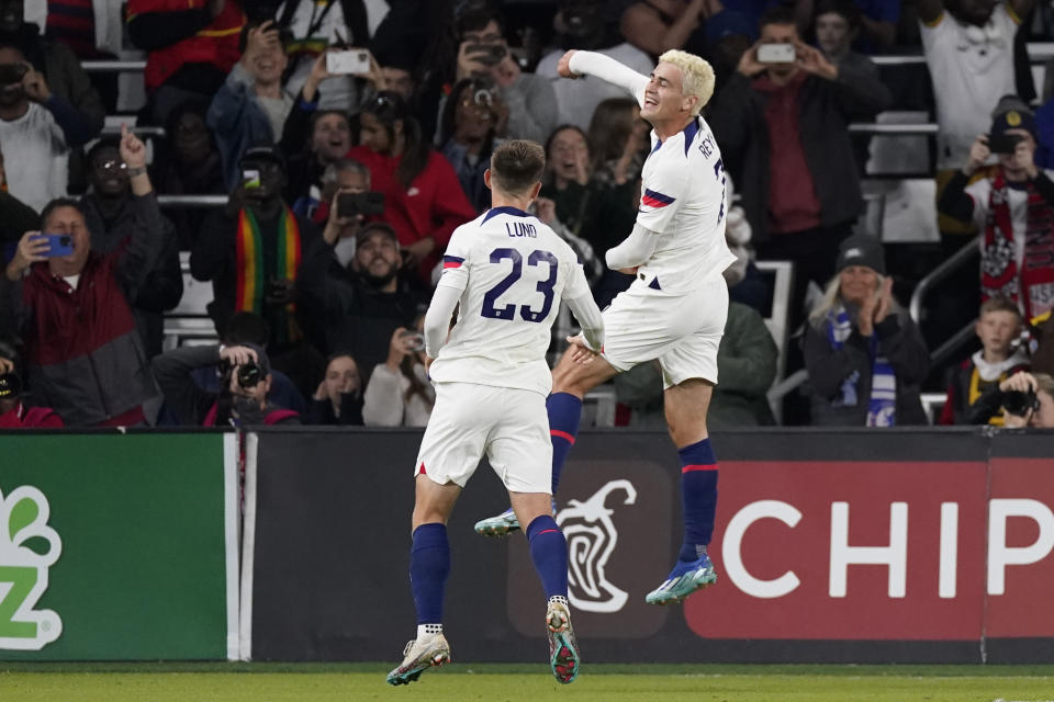 United States midfielder Gio Reyna, right, celebrates a goal with defender Kristoffer Lund (23) during the first half of an international friendly soccer match against Ghana, Tuesday, Oct. 17, 2023, in Nashville, Tenn. (AP Photo/George Walker IV)