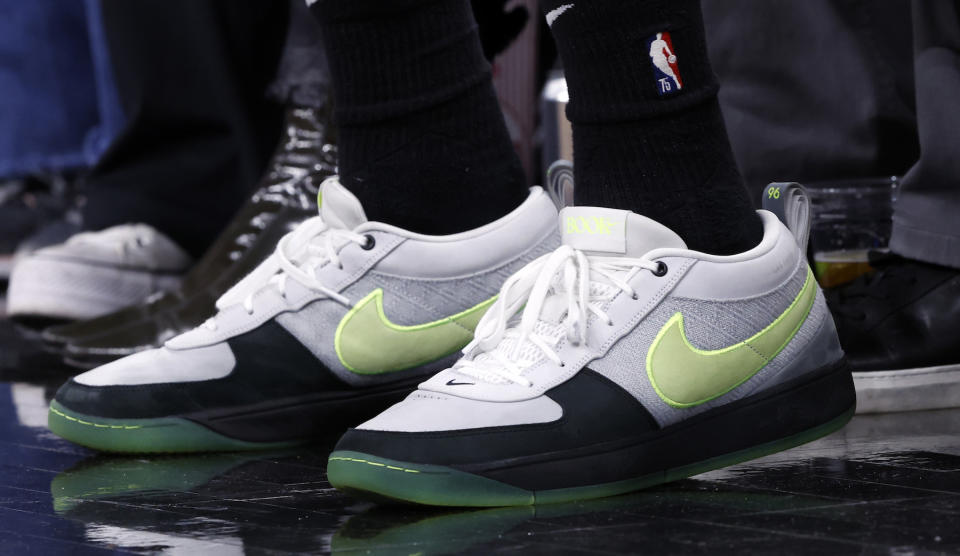 PHOENIX, ARIZONA - JANUARY 01: Close up of the shoes worn by Devin Booker #1 of the Phoenix Suns during the game against the Portland Trail Blazers at Footprint Center on January 01, 2024 in Phoenix, Arizona. The Suns defeated the Trail Blazers 109-88. NOTE TO USER: User expressly acknowledges and agrees that, by downloading and or using this photograph, User is consenting to the terms and conditions of the Getty Images License Agreement.  (Photo by Chris Coduto/Getty Images)