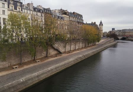 The path beside the River Seine near Pont Neuf is seen deserted after the area was partly closed by the poice in Paris, France, November 14, 2015, following a series of deadly attacks on the capital. REUTERS/Reinhard Krause