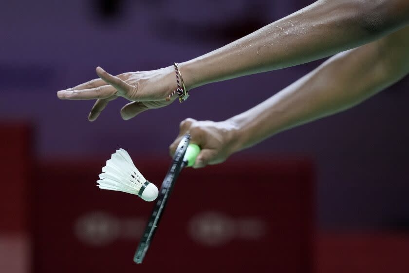 India's Pusarla V. Sindhu serves against Japan's Akane Yamaguchi during their women's singles badminton semifinal match at the BWF World Tour Finals in Nusa Dua, Bali, Indonesia, Saturday, Dec. 4, 2021. (AP Photo/Dita Alangkara)
