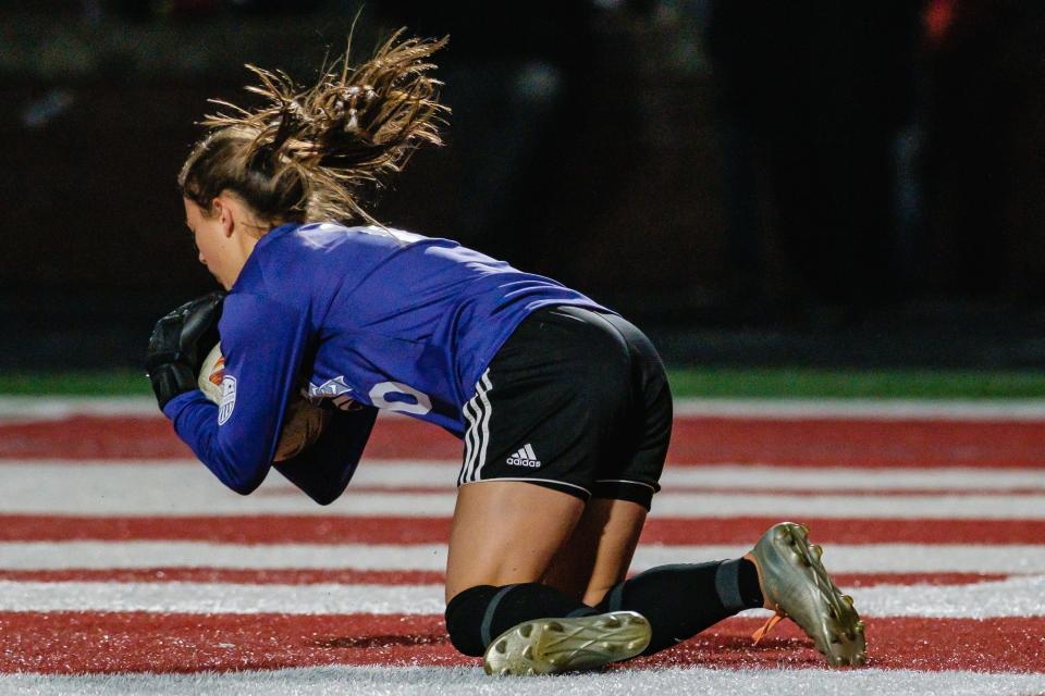 Dover's keeper Addie Steed makes a save during the game against New Phila, Saturday, Oct. 15 at Crater Stadium.