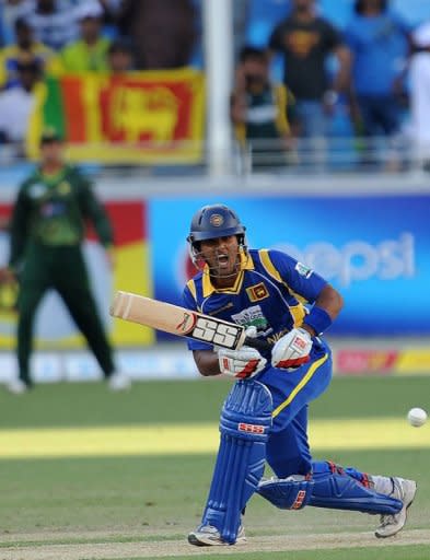 Sri Lankan cricketer Dinesh Chandimal plays a shot during the first One Day International (ODI) match against Pakistan at the Dubai cricket stadium in the Gulf emirate. Chandimal and Paranavitana added 30 for the third wicket before Pakistan's spinners ran riot, grabbing the last seven wickets for a mere 54 runs