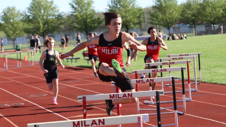 Braeden Lerette of Milan runs the hurdles during a meet against St. Mary Catholic Central on Tuesday, April 30, 2024.