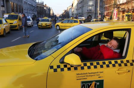 Taxis block a main road in Budapest's city centre, Hungary, January 18, 2016. REUTERS/Laszlo Balogh